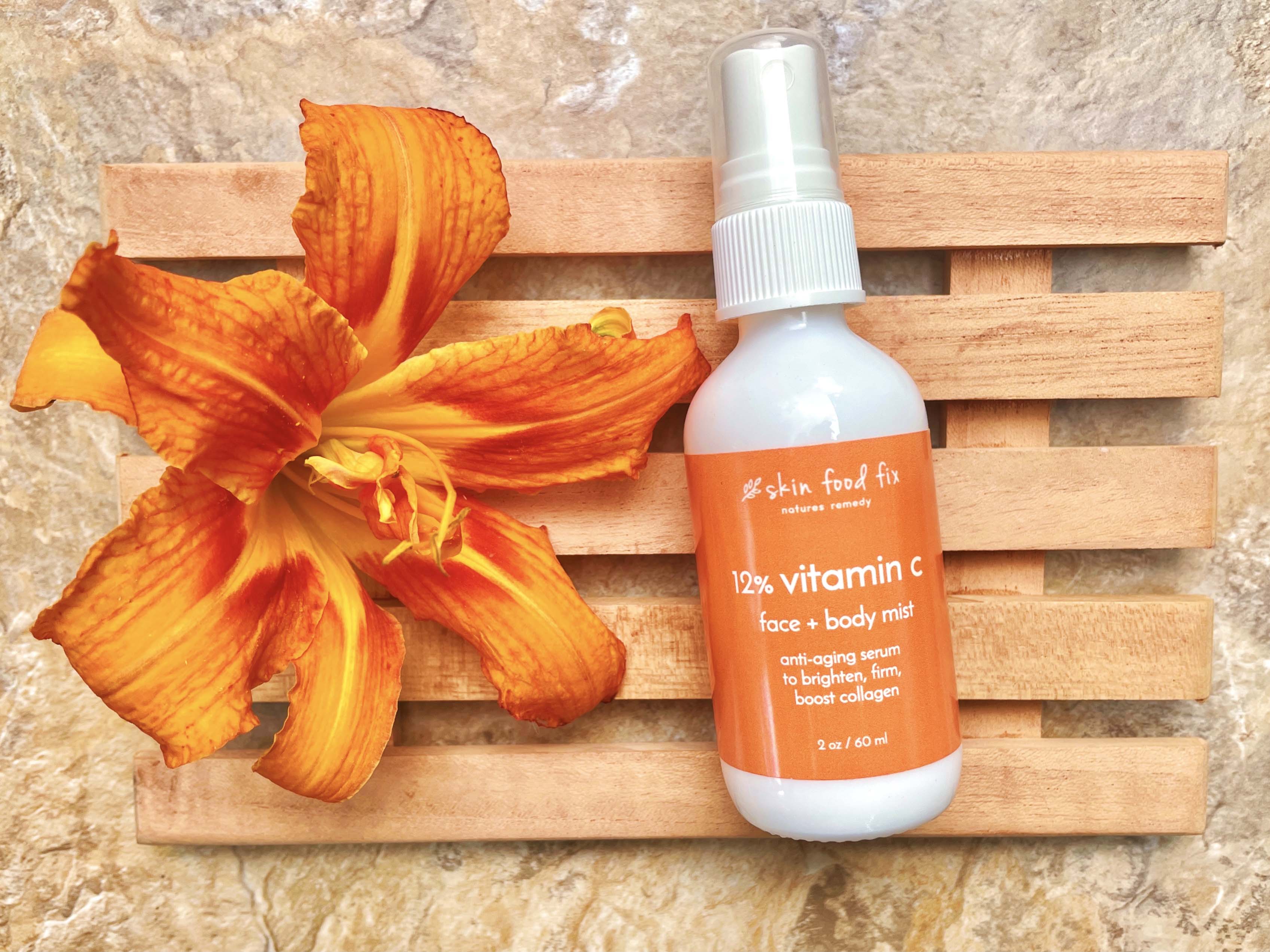 anti-aging serum bottle with orange daylily