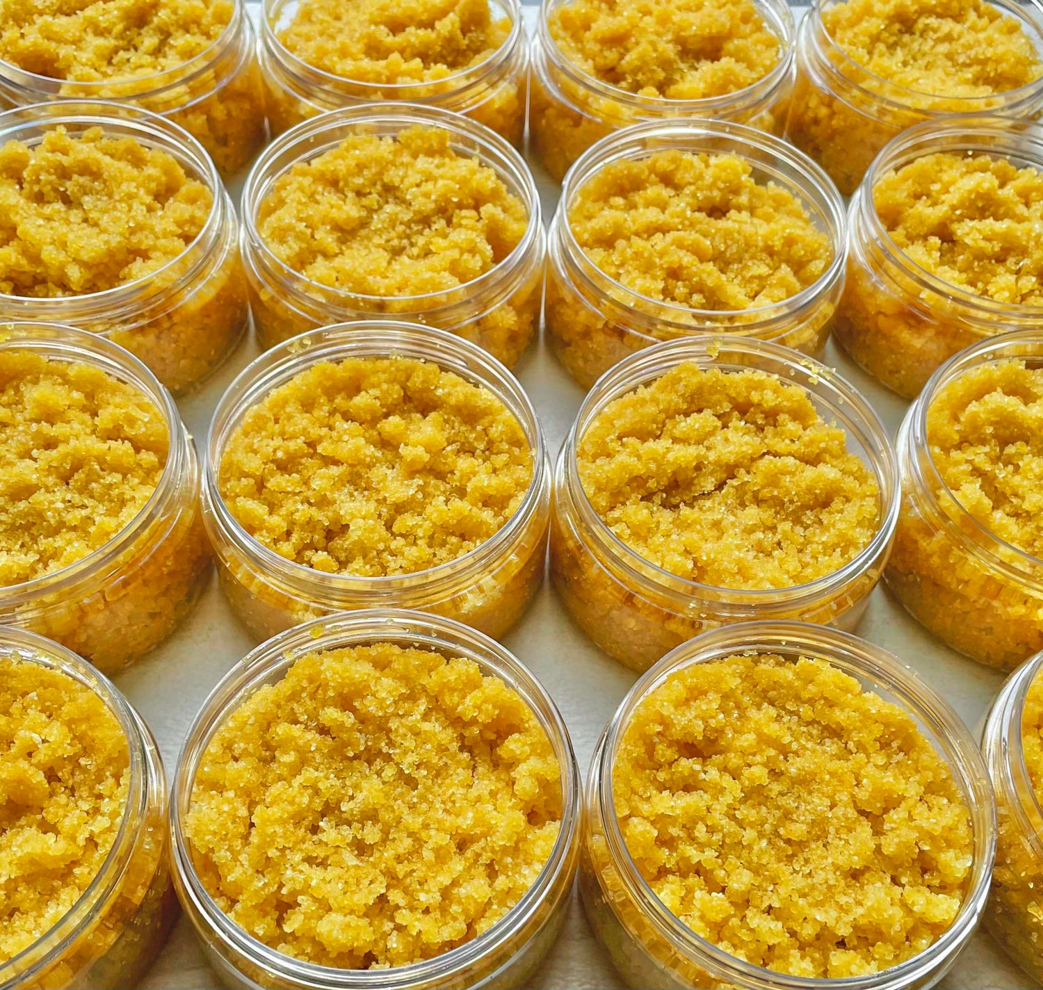 rows of turmeric and neem salt scrub jars 