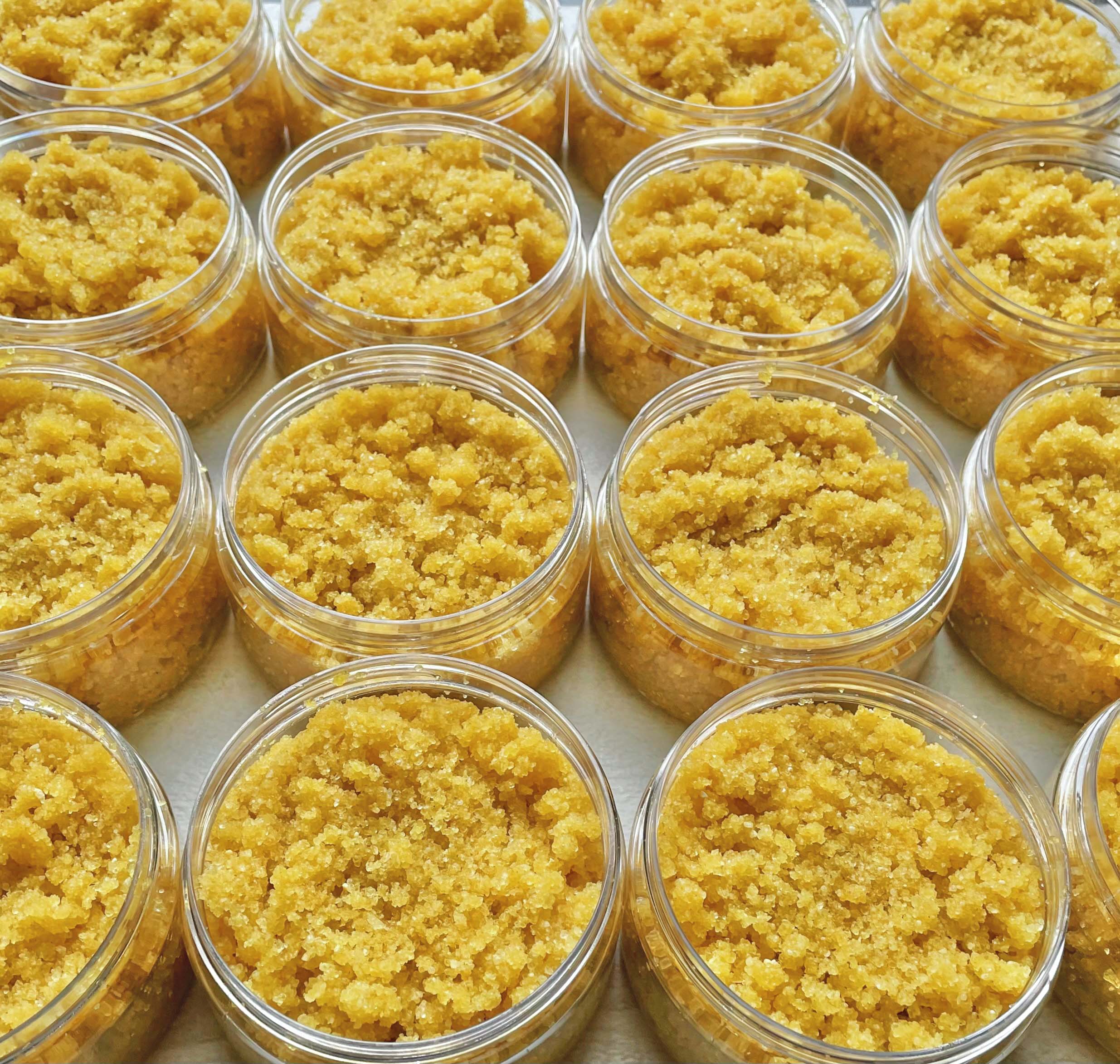 rows of turmeric and neem salt scrub jars 